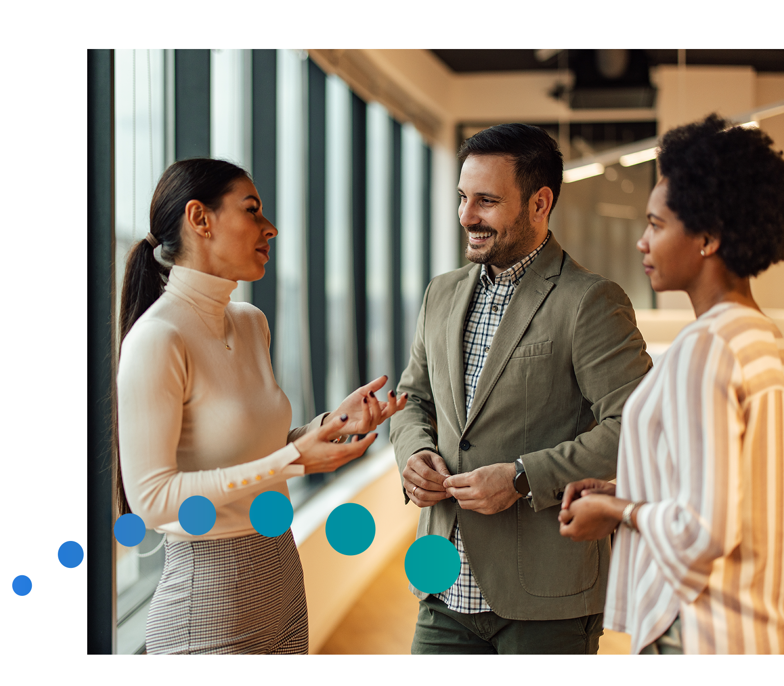Three employees discussing their finances