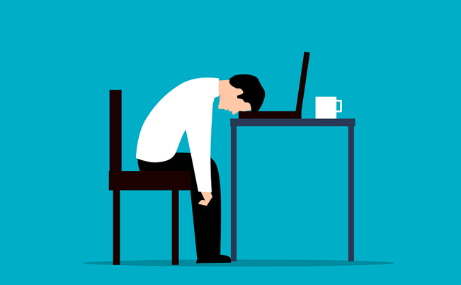 drawing of employee with head on desk