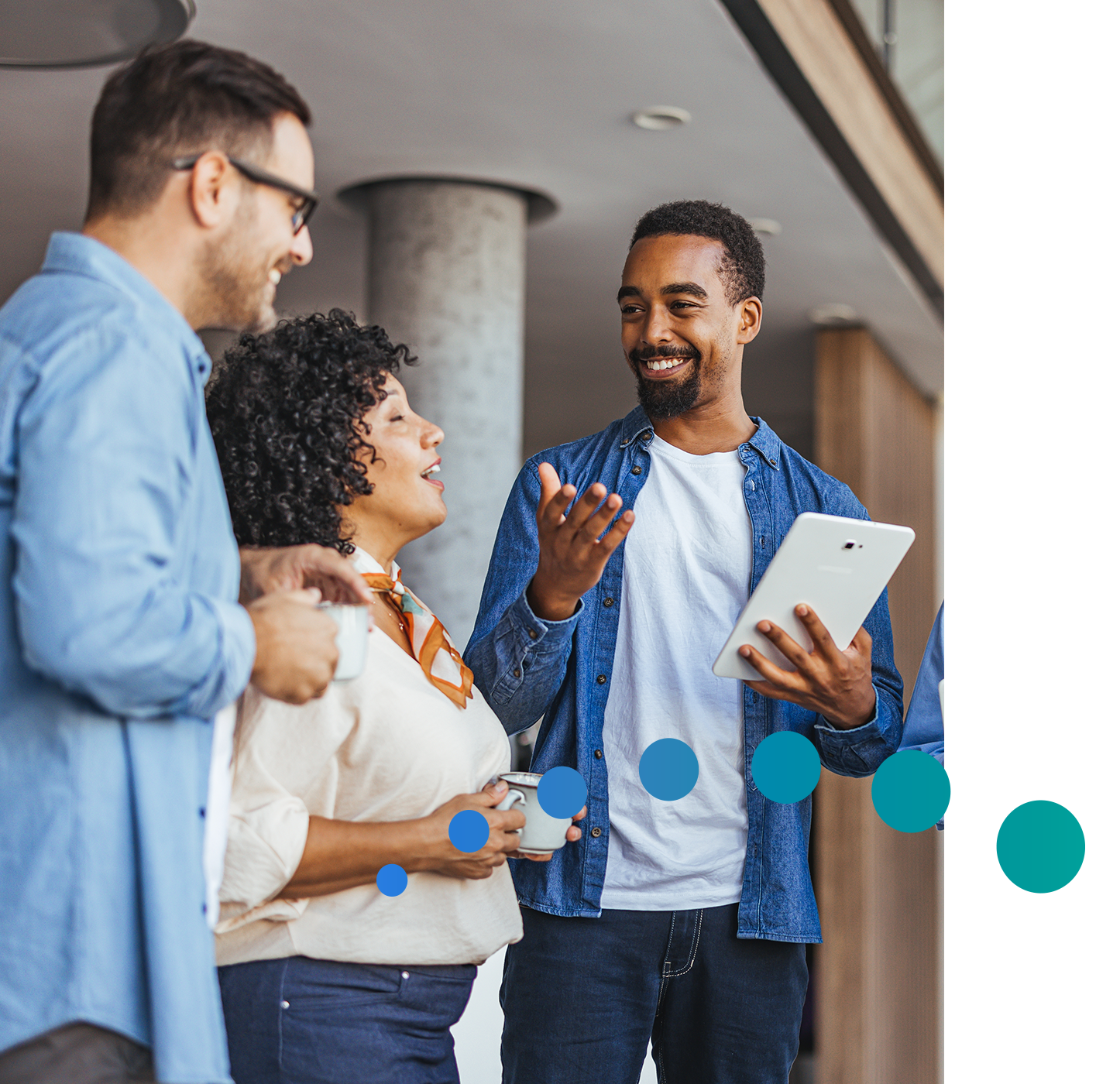 Three people looking at financial wellness on tablet